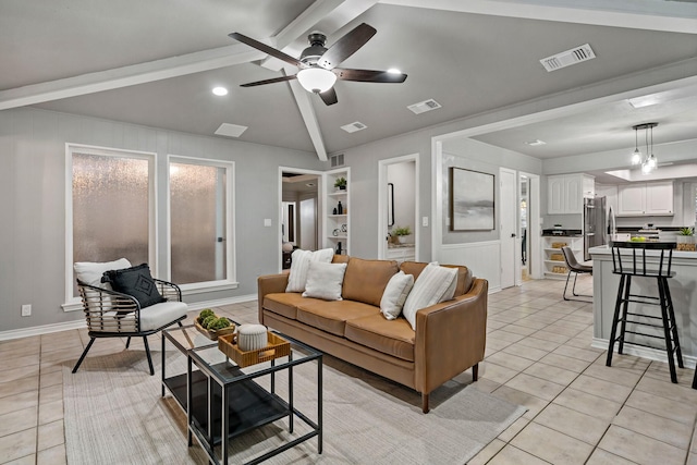 tiled living room featuring ceiling fan and lofted ceiling