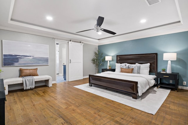 bedroom with ceiling fan, crown molding, and hardwood / wood-style flooring