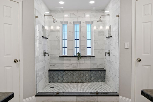 bathroom featuring a tile shower