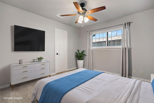 bedroom with light colored carpet and ceiling fan