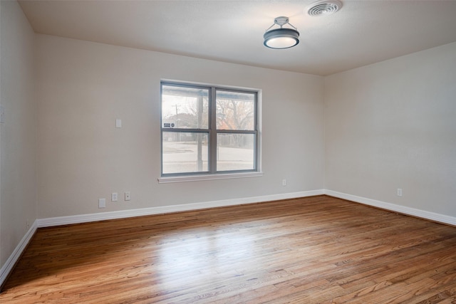 spare room featuring light hardwood / wood-style flooring