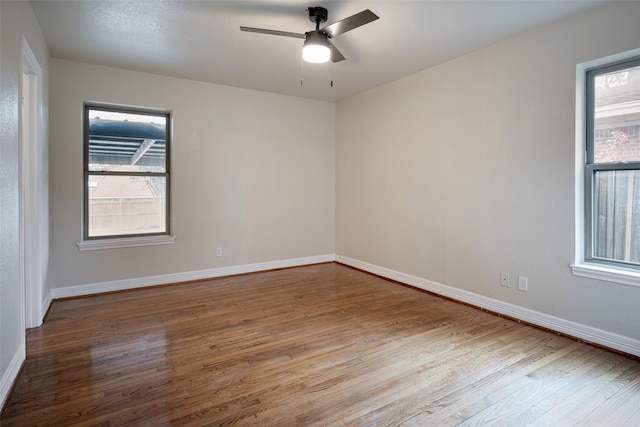 unfurnished room featuring light hardwood / wood-style flooring and ceiling fan