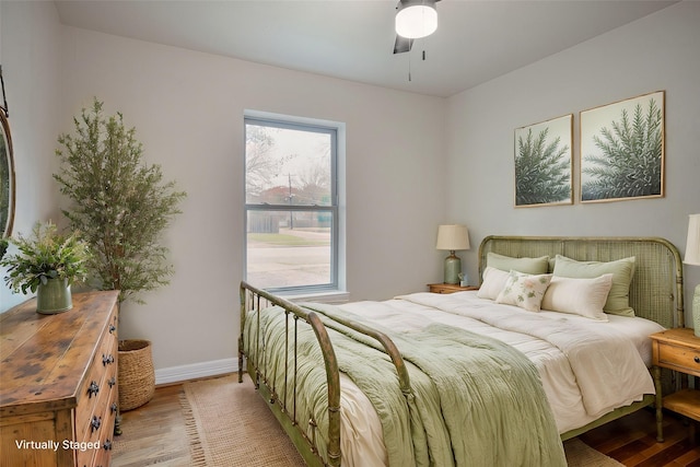 bedroom featuring ceiling fan and light hardwood / wood-style floors