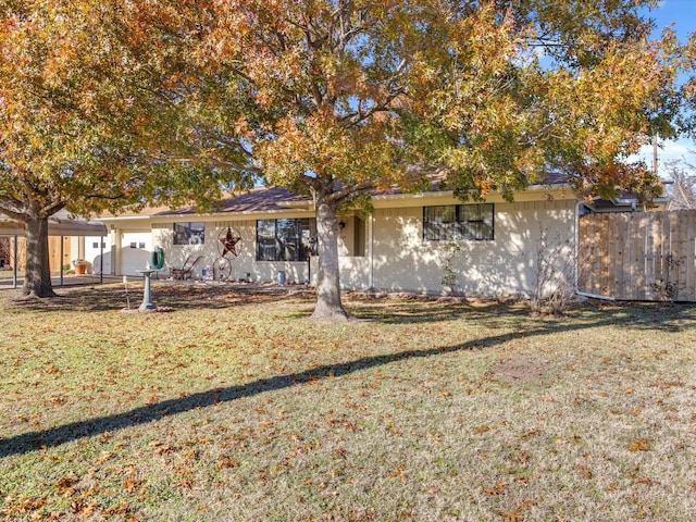 view of front of property with a garage and a front yard