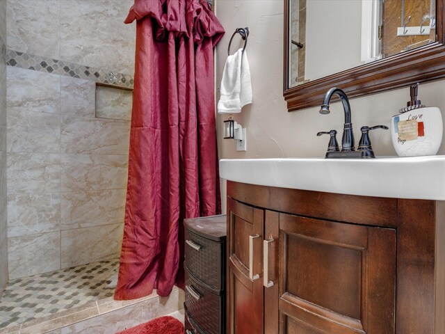 bathroom with vanity and walk in shower