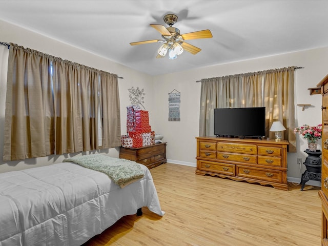 bedroom featuring ceiling fan and light hardwood / wood-style flooring