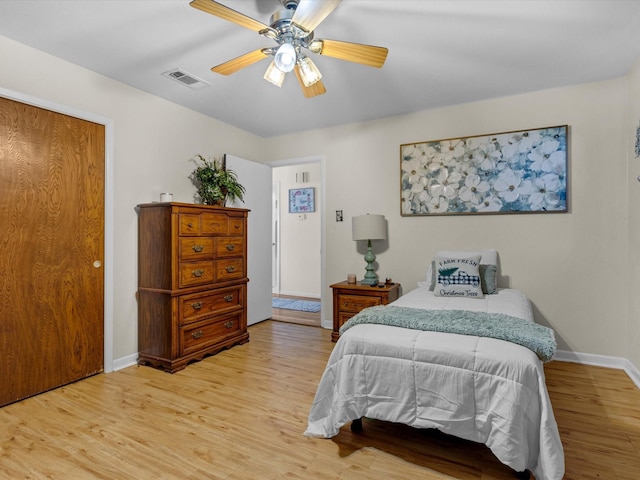 bedroom featuring hardwood / wood-style floors and ceiling fan