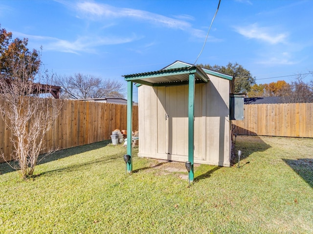 view of outdoor structure featuring a lawn