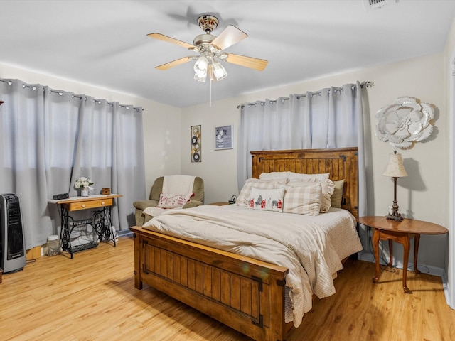 bedroom featuring ceiling fan and light hardwood / wood-style floors