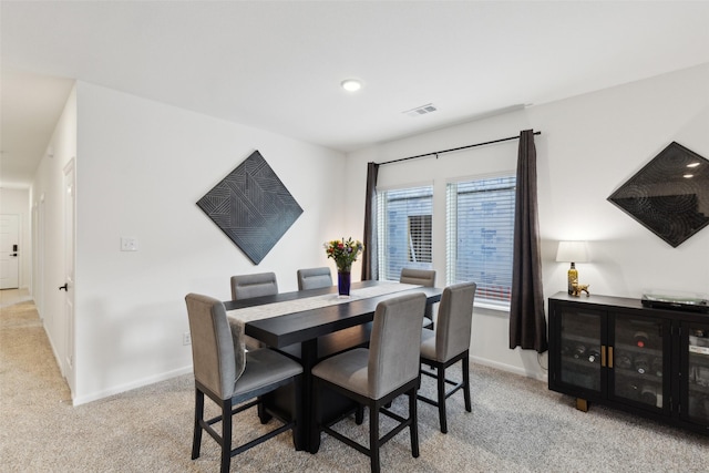 dining area with light carpet