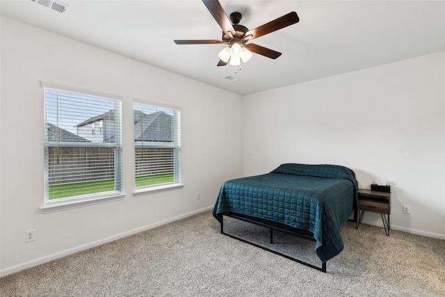 bedroom with ceiling fan and light colored carpet