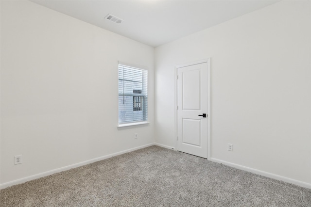 spare room featuring carpet floors