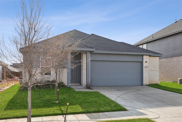 ranch-style house featuring a garage and a front yard