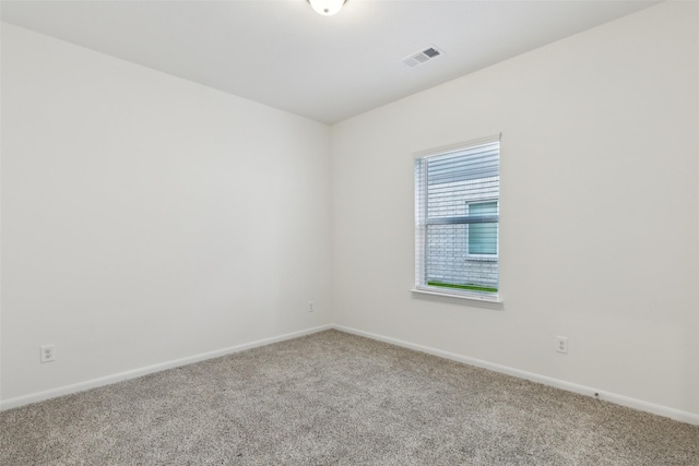 empty room featuring carpet floors