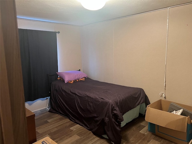 bedroom featuring dark hardwood / wood-style floors