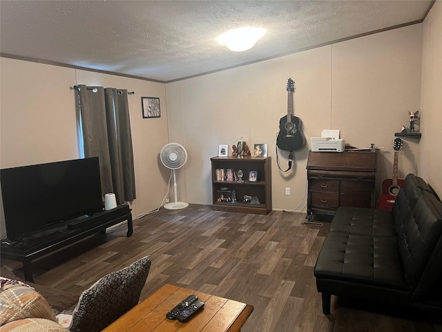 living room with a textured ceiling, crown molding, and dark hardwood / wood-style floors