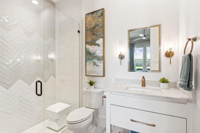 bathroom with vanity, an enclosed shower, and toilet