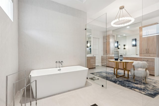 bathroom featuring vanity and a bath