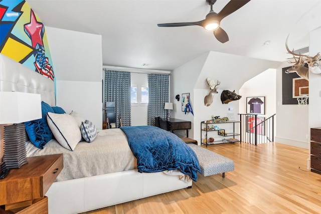 bedroom featuring hardwood / wood-style flooring and ceiling fan