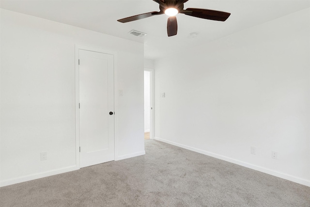 unfurnished bedroom with light colored carpet and ceiling fan