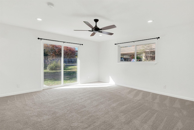 empty room with carpet and ceiling fan