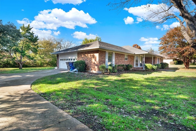 ranch-style home with a garage and a front lawn