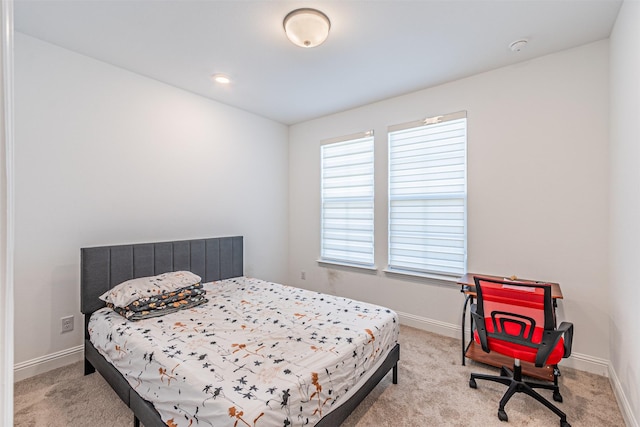 bedroom with light colored carpet