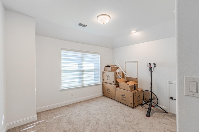 interior space featuring light colored carpet