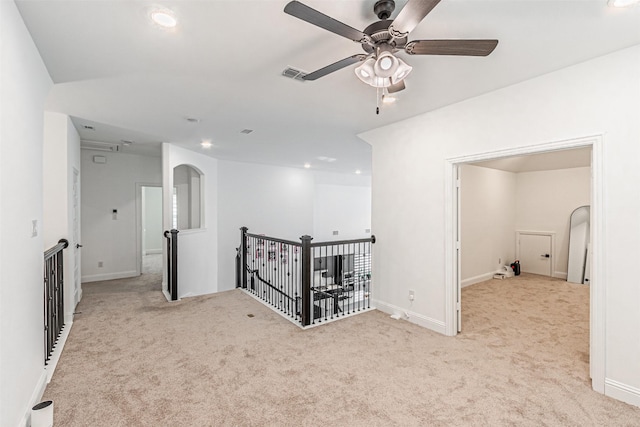 hallway with light colored carpet