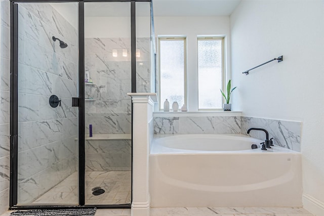 bathroom featuring independent shower and bath