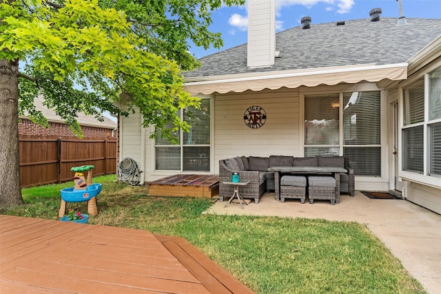 exterior space featuring outdoor lounge area, a yard, and a wooden deck