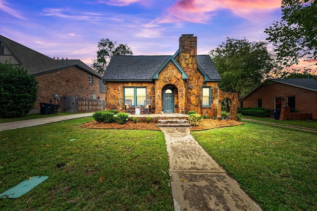 view of front of house with a yard