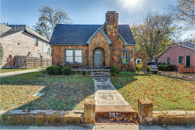 tudor house with a front yard