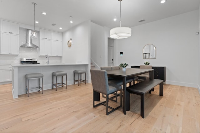 dining space featuring light hardwood / wood-style flooring