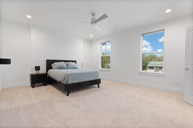 carpeted bedroom featuring ceiling fan