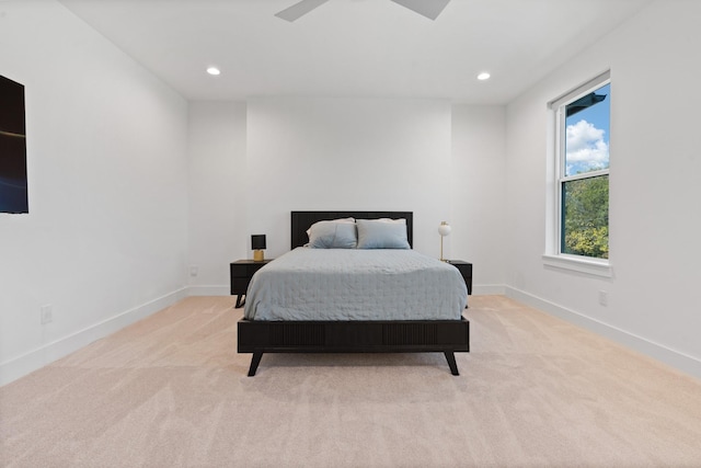 bedroom featuring light colored carpet