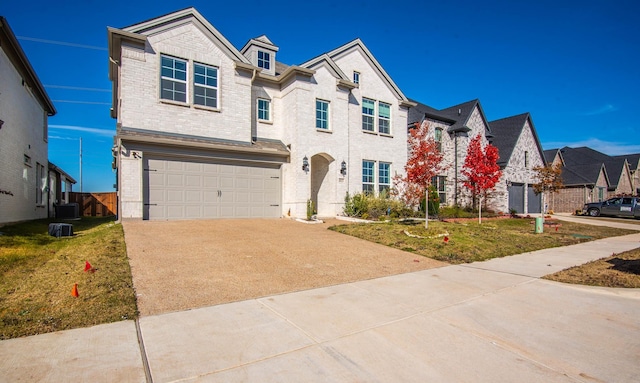 view of front facade featuring a front yard and a garage