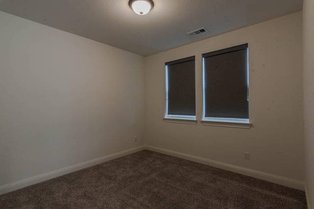 empty room featuring carpet flooring