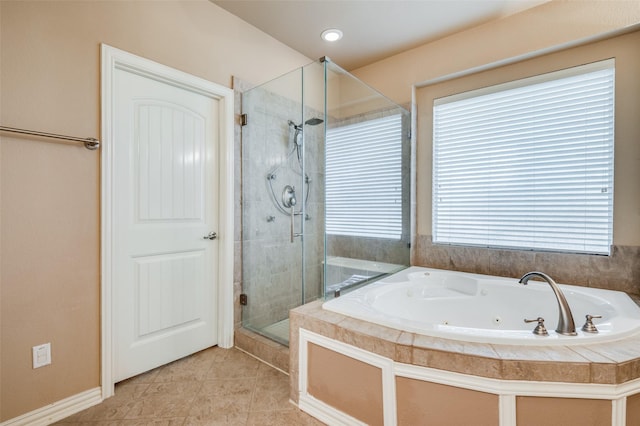 bathroom featuring tile patterned flooring and shower with separate bathtub