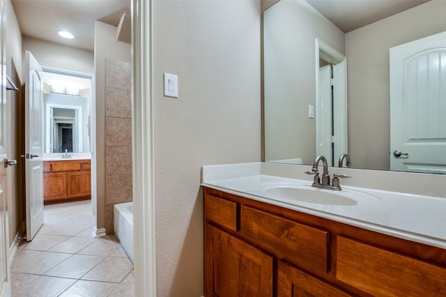 bathroom featuring bathing tub / shower combination, tile patterned floors, and vanity