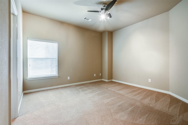 carpeted empty room featuring ceiling fan