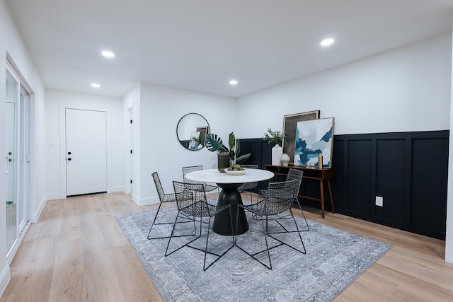 dining area with light hardwood / wood-style flooring