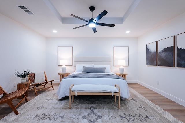 bedroom featuring hardwood / wood-style floors and ceiling fan