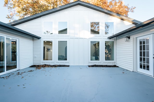 rear view of property featuring a patio area