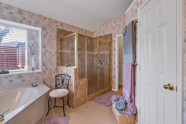 bathroom with lofted ceiling, a textured ceiling, and plus walk in shower