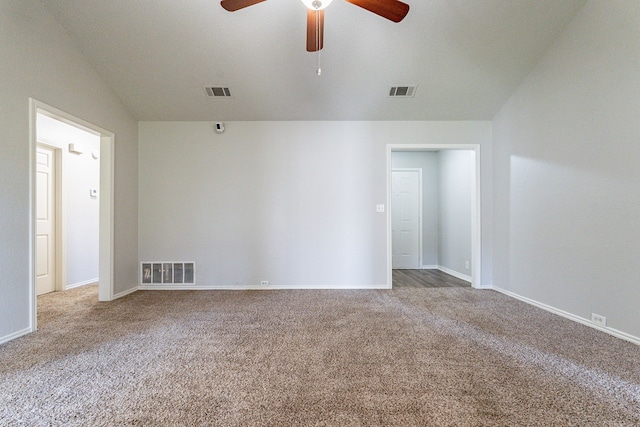 carpeted spare room with ceiling fan and lofted ceiling