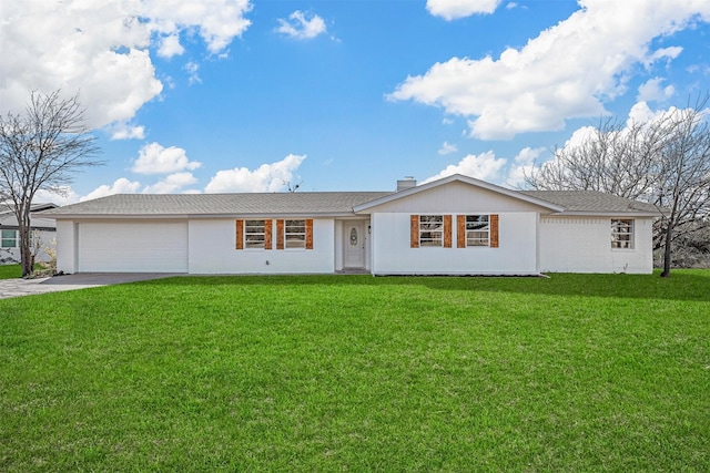 single story home with a front yard and a garage