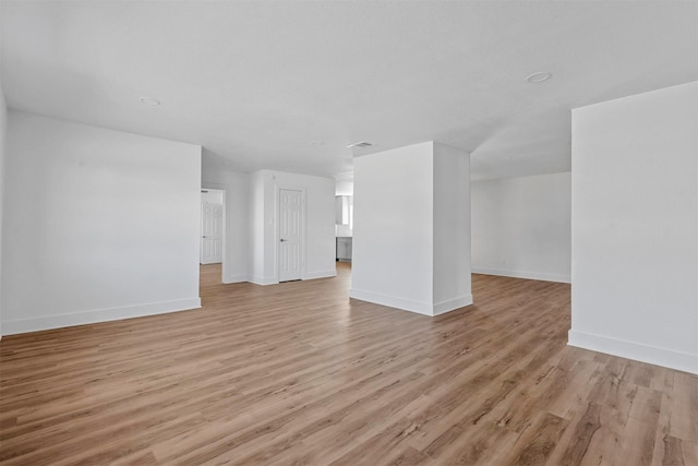 unfurnished living room with light wood-type flooring