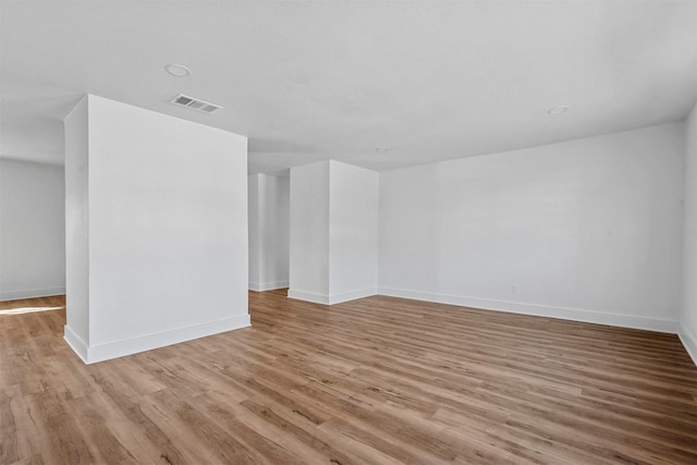 spare room with light wood-type flooring