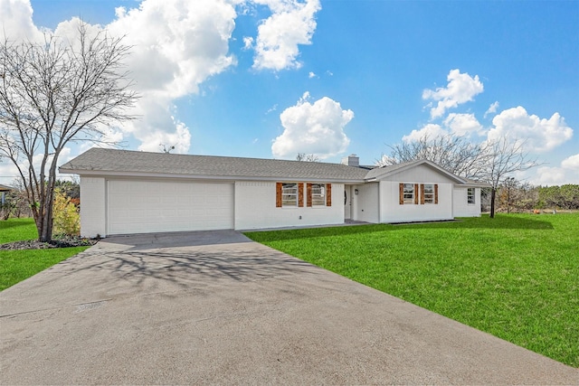 single story home with a garage and a front lawn